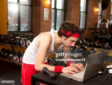 Muscle Man Using Computer Man On Computer At Gym High-Res Stock Photo - Getty Images