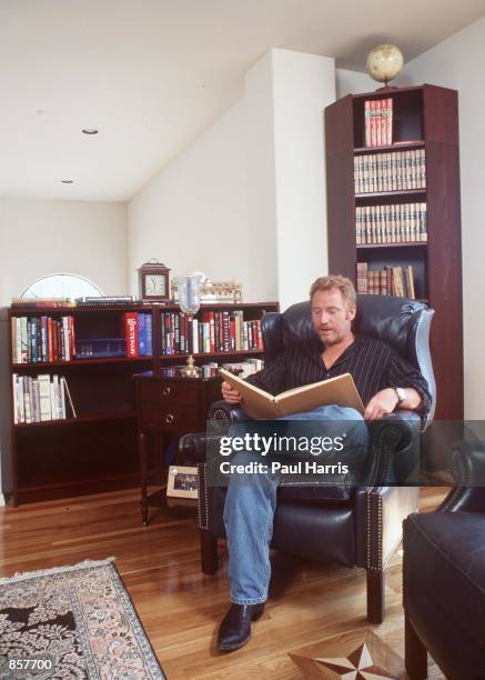 Hollywood Hills, CA. Former "Partridge Family" child star, Danny Bonaduce enjoys a quiet time reading in his library. The actor-turned-deejay...