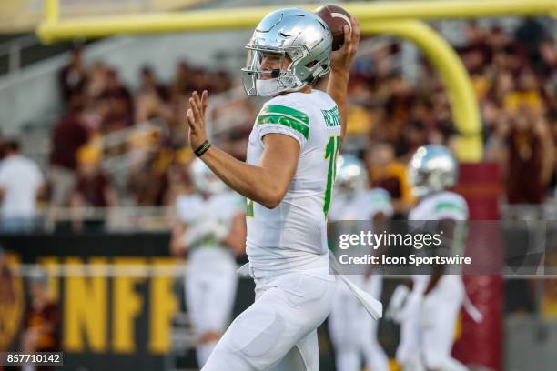 Oregon Ducks quarterback Justin Herbert throws a pass during warm ups before the college football game between the Oregon Ducks and the Arizona State...