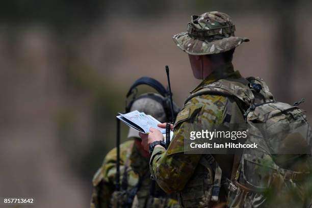 Course member checks his map before live ordance is dropped from a RAAF F/A-18 Hornet as part of Exercise Black Dagger on October 5, 2017 in...