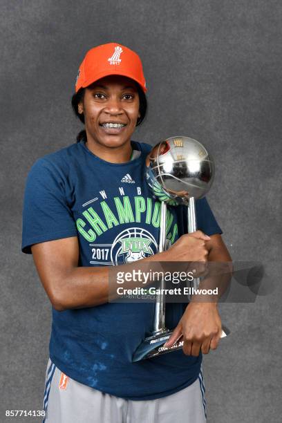 Jia Perkins of the Minnesota Lynx poses for a portrait while holding the 2017 WNBA Championship trophy after the game against the Los Angeles Sparks...