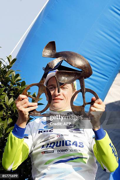 Belgian cyclist Frederik Willems of team Liquigas and winner of the 'KBC Driedaagse De Panne', holds his trophy as he stands on the podium after the...