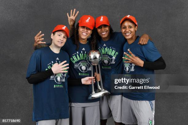 Lindsay Whalen, Seimone Augustus, Rebekkah Brunson, and Maya Moore of the Minnesota Lynx poses for a portrait while holding the 2017 WNBA...