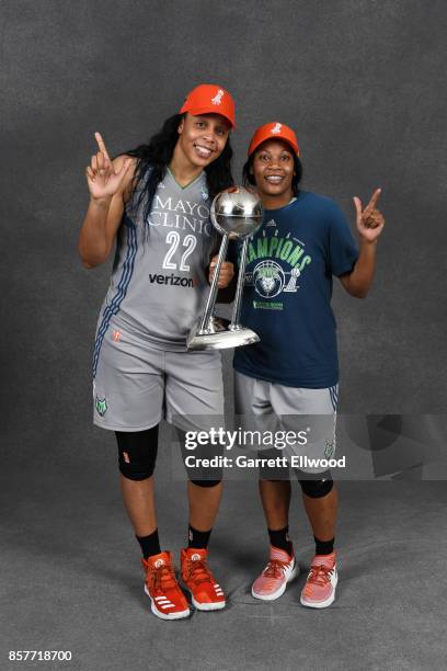 Plenette Pierson and Jia Perkins of the Minnesota Lynx pose for a portrait while holding the 2017 WNBA Championship trophy after the game against the...