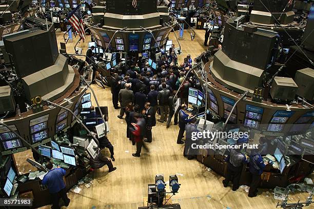 Traders work on the floor of the New York Stock exchange during afternoon trading April 2, 2009 in New York City. The Dow Jones industrials rose...