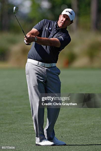 Phil Mickelson makes a shot from the fairway on the 12th hole during the first round of the Shell Houston Open at Redstone Golf Club April 2, 2009 in...