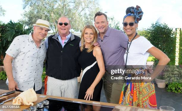 Vanna White and 'The Chew' co-hosts Clinton Kelly; Mario Batali, Michael Symon and Carla Hall pose at Epcot Center at Walt Disney World on October 4,...