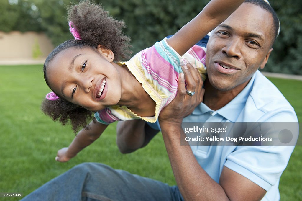 Father and Daughter Playing Outdoors