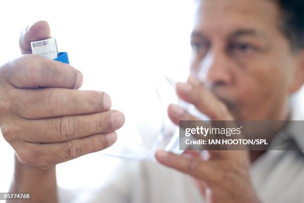 Person Using An Inhaler 74 Asthma Inhaler And Spacer Stock Photos, High-Res Pictures, and ...