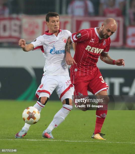 Slavoljub Srnic of Belgrad and Konstantin Rausch of Koeln battle for the ball during the UEFA Europa League group H match between 1. FC Koeln and...