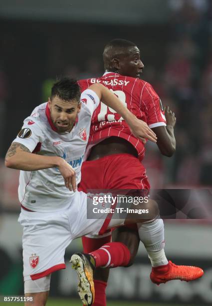 Damien Le Tallec of Belgrad and Sehrou Guirassy of Koeln battle for the ball during the UEFA Europa League group H match between 1. FC Koeln and...