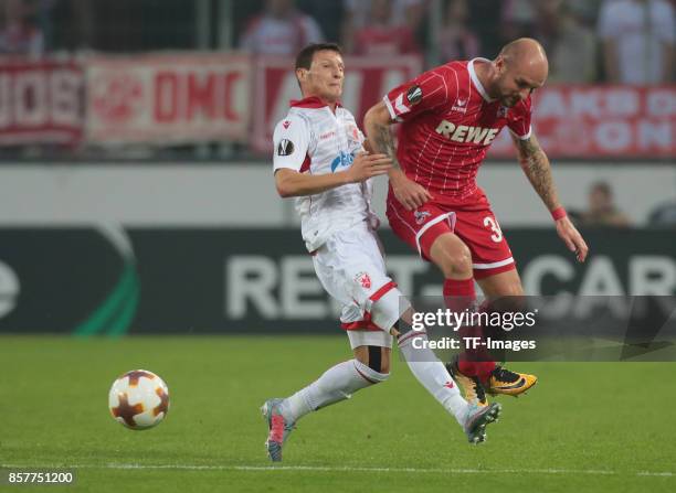 Slavoljub Srnic of Belgrad and Konstantin Rausch of Koeln battle for the ball during the UEFA Europa League group H match between 1. FC Koeln and...