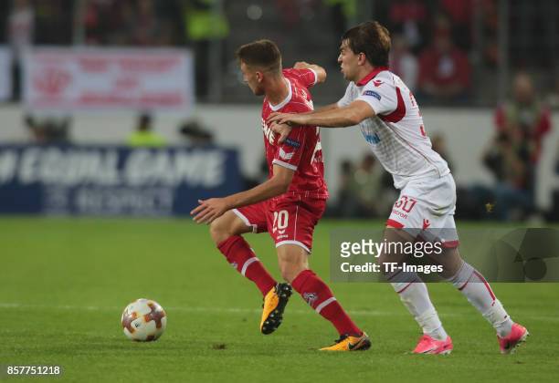 Salih Oezcan of Koeln and Filip Stojkovic of Belgrad battle for the ball during the UEFA Europa League group H match between 1. FC Koeln and Crvena...
