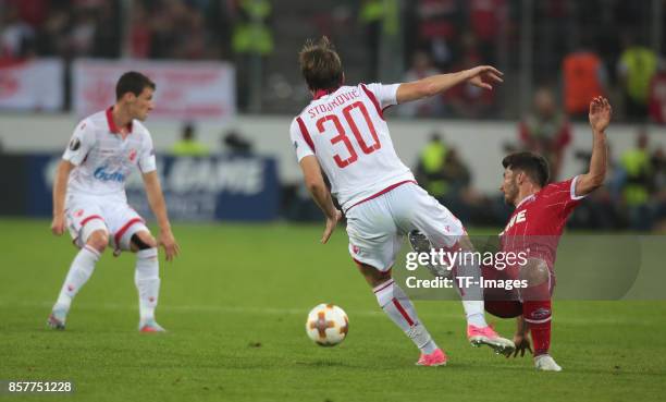 Milos Jojic of Koeln and Filip Stojkovic of Belgrad battle for the ball during the UEFA Europa League group H match between 1. FC Koeln and Crvena...