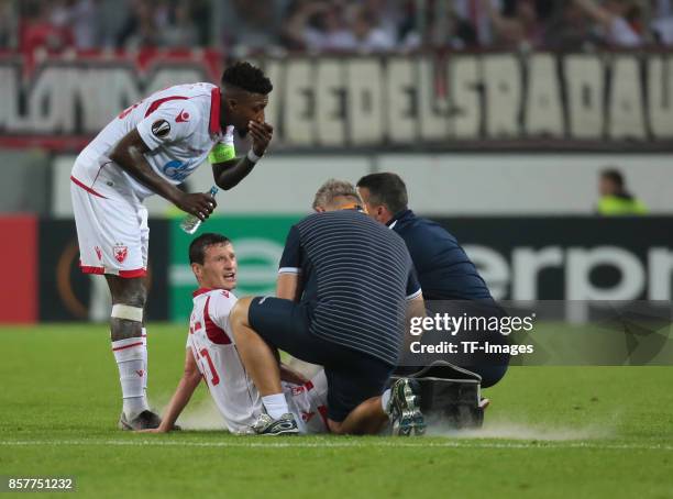 Slavoljub Srnic of Belgrad on the ground during the UEFA Europa League group H match between 1. FC Koeln and Crvena Zvezda at RheinEnergieStadion on...