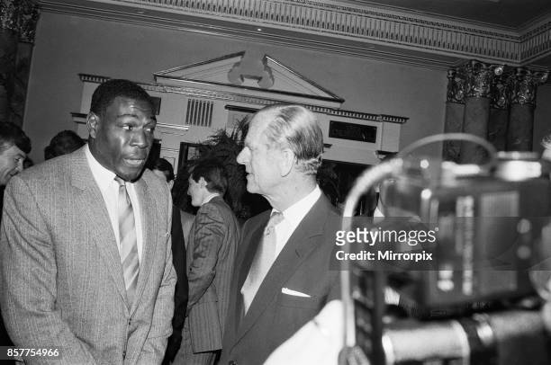 Duke Of Edinburgh meets Frank Bruno at the Variety Club's sports lunch at the Dorchester, London. 24th May 1988.