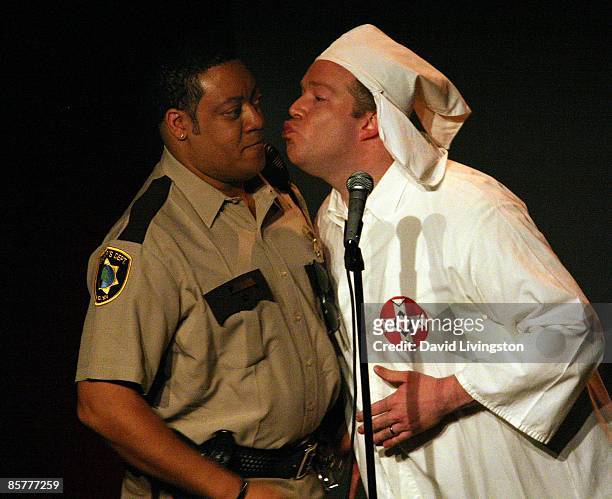 Actors Cedric Yarbrough and and Chris Tallman perform on stage during the "Reno 911!" benefit for Planting Peace at Largo at the Coronet Theatre on...