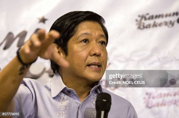 Ferdinand "Bongbong" Marcos Jnr, former senator and son of the late dictator Ferdinand Marcos, gestures during a press conference in Manila on...