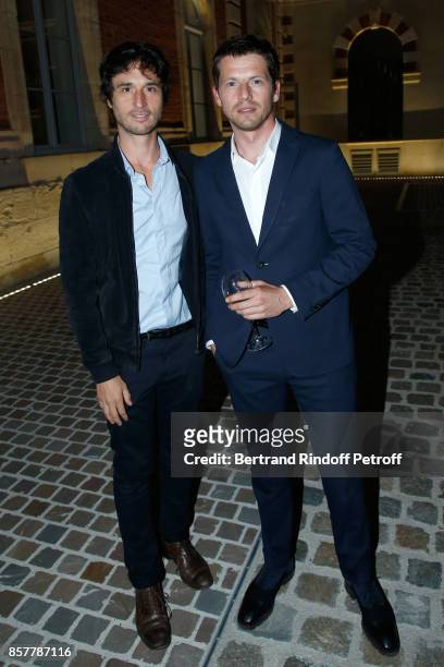 Actors Jeremie Elkaim and Pierre Deladonchamps attend the "Diner Surrealiste" to celebrate the 241th birthday of "Maison Louis Roederer" on October...