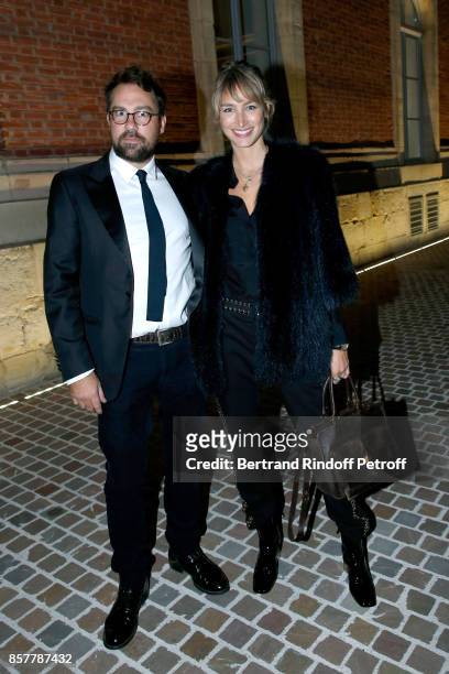 Pauline Lefevre and her husband Julien Ansault attend the "Diner Surrealiste" to celebrate the 241th birthday of "Maison Louis Roederer" on October...