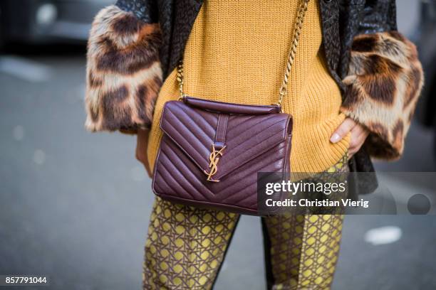 Gitta Banko wearing a mustard colored sweater from Mango, brocade jacket with fake fur trimming in leopard pattern by Steffen Schraut, pants with...