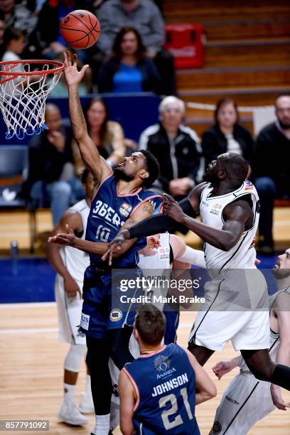 Adelaide's Ramone Moore makes a baskey under pressure during the round one NBL match between the Adelaide 36ers and Melbourne UInited at Titanium...