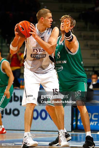 Marijonas Petravicius of Lietuvos Rytas competes with CJ Wallace of Benetton Basket Tamoil during the Eurocup Basketball Quarter Final 2 between...