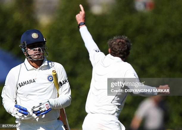 New Zealand cricketer Iain O'Brien celebrates the wicket of Indian batsman Virender Sehwag during the first day of the final Test between New Zealand...