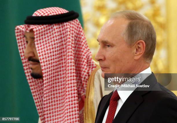 Russian President Vladimir Putin greets King Salman bin Abdulaziz Al Saud of Saudi Arabia at the Grand Kremlin Palaceon October 5, 2017 in Moscow,...