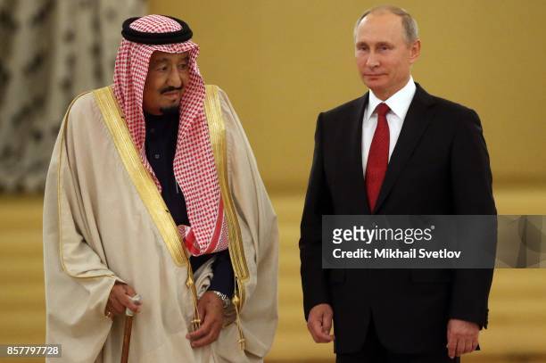 Russian President Vladimir Putin greets King Salman bin Abdulaziz Al Saud of Saudi Arabia at the Grand Kremlin Palaceon October 5, 2017 in Moscow,...