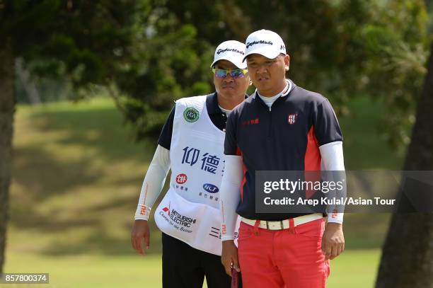 Lu Wei-chih of Taiwan in action during round one for the Yeangder Tournament Players Championship at Linkou lnternational Golf and Country Club on...