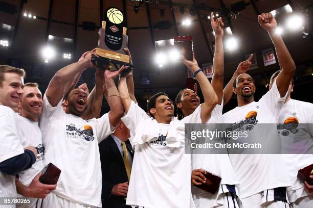 Players from the Penn State Nittany Lions hold aloft the championship trophy after defeating the Baylor Bears during the NIT Championship match at...