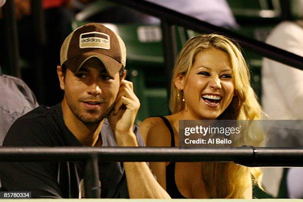 Enrique Iglesias and girlfriend Anna Kournikova watch as Venus Williams plays her semifinal match against Serena Williams at the Sony Ericsson Open...