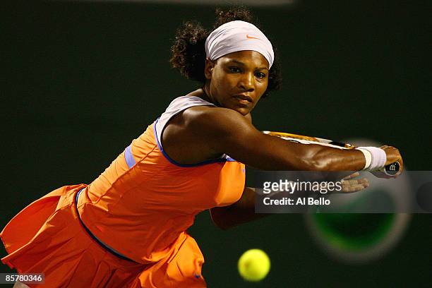 Serena Williams returns a shot during her semifinal match against Venus Williams at the Sony Ericsson Open at the Crandon Park Tennis Center on April...