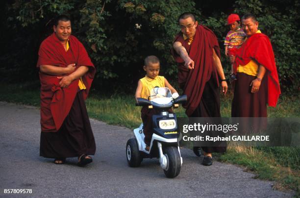 Tulkou Kalou Rimpotche enjoying playtime with buddhist monks on July 22, 1994 in La Boulaye, France.