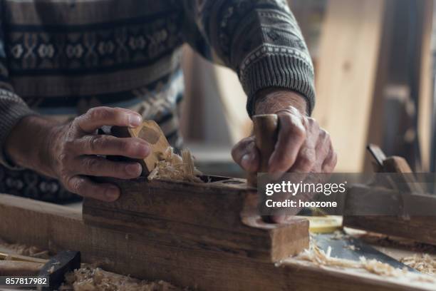 close-up hands of senior carpenter milling - milling cutter stock pictures, royalty-free photos & images