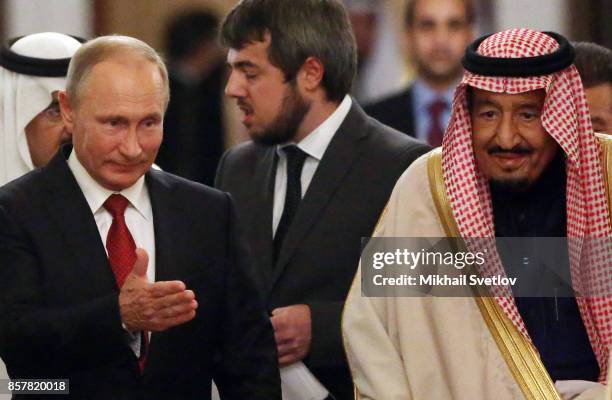 Russian President Vladimir Putin greets King Salman bin Abdulaziz Al Saud of Saudi Arabia at the Grand Kremlin Palace on October 5, 2017 in Moscow,...