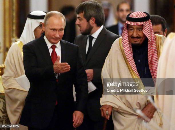 Russian President Vladimir Putin greets King Salman bin Abdulaziz Al Saud of Saudi Arabia at the Grand Kremlin Palace on October 5, 2017 in Moscow,...