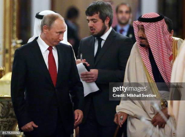 Russian President Vladimir Putin greets King Salman bin Abdulaziz Al Saud of Saudi Arabia at the Grand Kremlin Palace on October 5, 2017 in Moscow,...