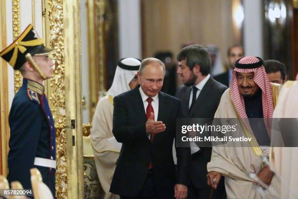 Russian President Vladimir Putin greets King Salman bin Abdulaziz Al Saud of Saudi Arabia at the Grand Kremlin Palace on October 5, 2017 in Moscow,...