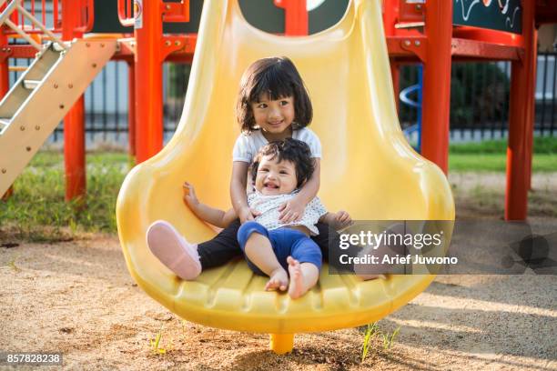 playing together - sister stock pictures, royalty-free photos & images