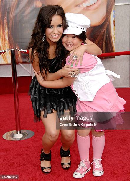 Actress/singer Demi Lovato and sister actress Madison De La Garza arrive at the Los Angeles Premiere "Hannah Montana The Movie" at the El Capitan...