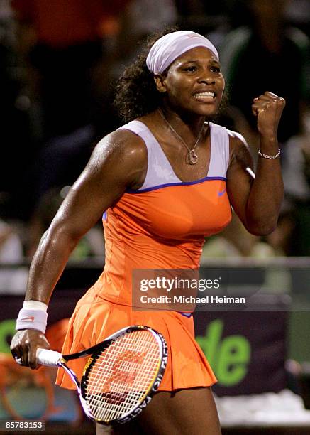 Serena Williams celebrates after winning her semifinal match against Venus Williams at the Sony Ericsson Open at the Crandon Park Tennis Center on...