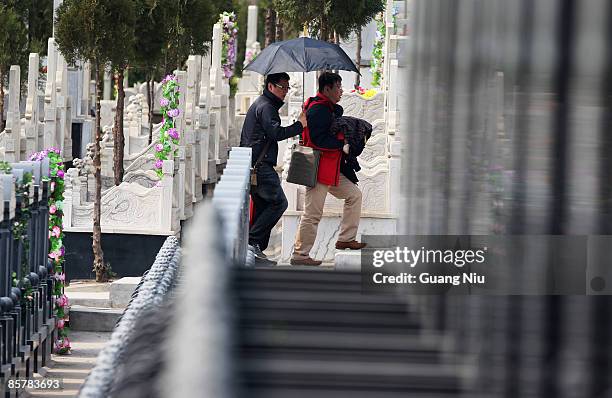 People commemorate the deceased to mark the Qingming Festival at the Anling Cemetery on April 3, 2009 in Beijing, China. The Qingming Festival, also...