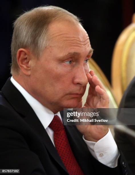 Russian President Vladimir Putin looks on during a meeting with King Salman bin Abdulaziz Al Saud of Saudi Arabia at the Grand Kremlin Palace on...