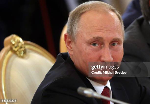 Russian President Vladimir Putin looks on during a meeting with King Salman bin Abdulaziz Al Saud of Saudi Arabia at the Grand Kremlin Palace on...