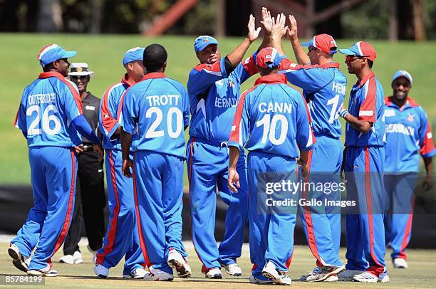 Bermuda celebrate the wicket of Mohammad Shahzad Mohammadi of Afganistan during the ICC Mens Cricket World Cup qualifier match between Bermuda and...