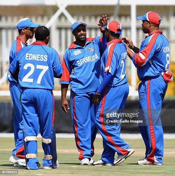 Steven Outerbridge of Bermuda celebrates the wicket of Karim Sadiq of Afganistan with his teammates during the ICC Mens Cricket World Cup qualifier...