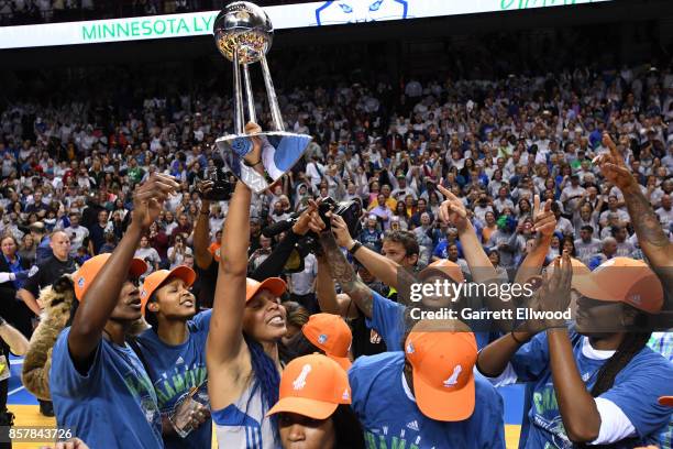 Plenette Pierson of the Minnesota Lynx holds up the trophy with her teammates after defeating the Los Angeles Sparks in Game 5 of the 2017 WNBA...