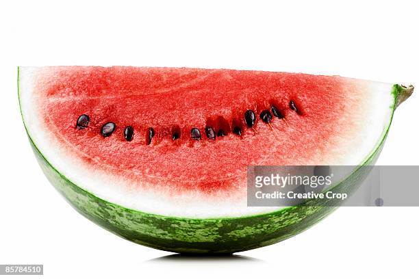 a slice of fresh red watermelon - pastèque photos et images de collection